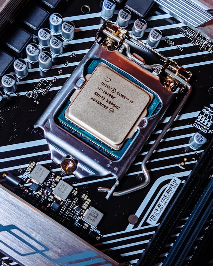 Detailed view of an Intel i7 processor installed on a computer motherboard.
