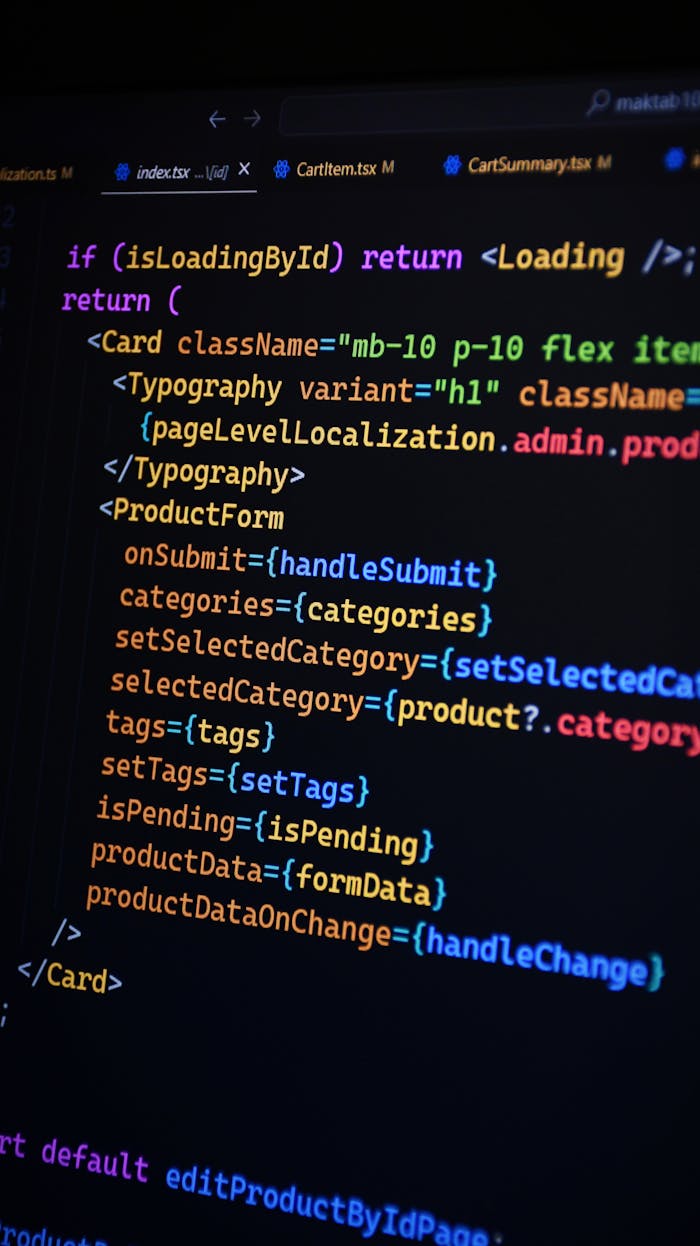 Crafting Captivating Headlines: Your awesome post title goes here Close-up of JSX code on a monitor, showcasing colorful syntax used in ReactJS development.