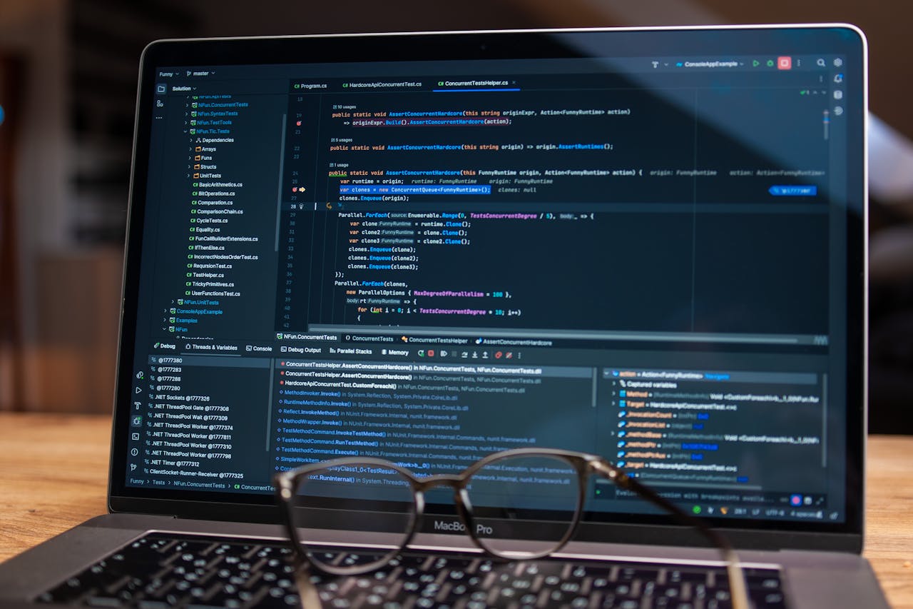 The Art of Drawing Readers In: Your attractive post title goes here Laptop screen showing debugging software with code, perfect for tech and software development themes.
