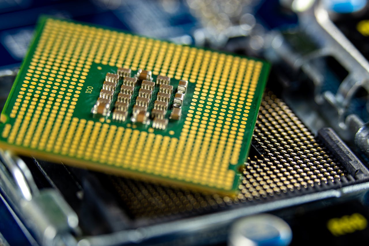 Detailed close-up of a microprocessor on a motherboard showcasing its intricate design.